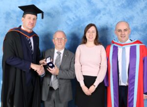 Mr Alan Lowe, being presented with the Governing Body Medal by sponsor Tom Kirby, Secretary of LASNTG accompanied by Róisín Smith, Senior Executive Engineer LASNTG and Dr Brian McCann, Programme Chair at IT Sligo